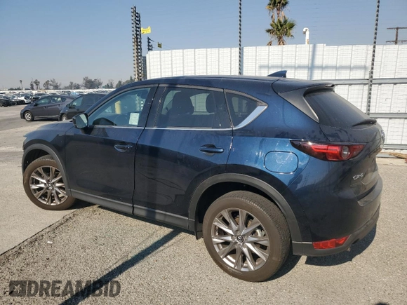 2021 Mazda CX-5 Grand Touring with VIN JM3KFADM7M0385788, listed as a Copart auction lot 88065255 with 27,787 mi miles and Salvage Title. Bid and sale history available at carsss.com. Image 2.