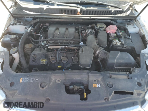 2013 Ford Taurus Limited z VIN 1FAHP2F8XDG202743, wystawiony jako Copart lot #48457145 z przebiegiem 161 331 mil mil oraz Szkoda całkowita • Salvage title. Historia ofert i sprzedaży dostępna na DreamBid. Obrazek 11.