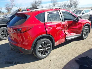 2016 Mazda CX-5 Grand Touring with VIN JM3KE4DY0G0709563, listed as a IAAI auction lot 41886956 with 156,769 mi miles. Bid and sale history available at carsss.com. Image 4.