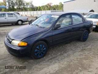 1997 Mazda Protege DX with VIN JM1BC1418V0171451, listed as a Copart auction lot 72309444 with Not Provided miles and Salvage Title. Bid and sale history available at DreamBid. Image 1.