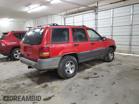 1997 Jeep Grand Cherokee Laredo with VIN 1J4GZ58Y9VC629994, listed as a Copart auction lot 83086694 with 252,147 mi miles and Salvage Title. Bid and sale history available at carsss.com. Image 3.