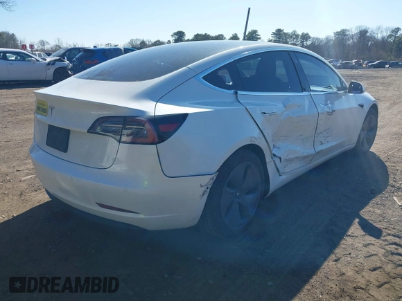 2020 Tesla Model 3 Standard Range Plus with VIN 5YJ3E1EA0LF783672, listed as a IAAI auction lot 41903431 with 52,157 mi miles and . Bid and sale history available at carsss.com. Image 4.
