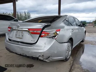 2014 Toyota Avalon Limited with VIN 4T1BK1EB3EU104576, listed as a IAAI auction lot 41773431 with 105,419 mi miles. Bid and sale history available at carsss.com. Image 4.