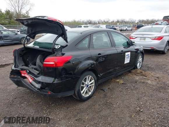 2016 Ford Focus SE with VIN 1FADP3F23GL280843, listed as a IAAI auction lot 41917538 with 125,392 mi miles. Bid and sale history available at carsss.com. Image 4.