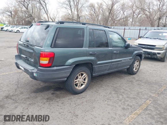 2003 Jeep Grand Cherokee Laredo with VIN 1J4GX48S03C536709, listed as a IAAI auction lot 41908946 with 240,435 mi miles. Bid and sale history available at carsss.com. Image 4.