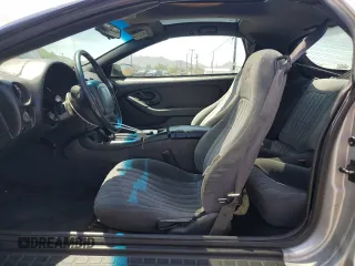 2000 Pontiac Firebird Firebird z VIN 2G2FS22K5Y2116047, wystawiony jako Copart lot #58234695 z przebiegiem 155 876 mil mil oraz Tytuł czysty. Historia ofert i sprzedaży dostępna na DreamBid. Obrazek 7.