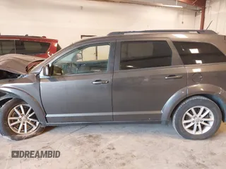 2017 Dodge Journey SXT z VIN 3C4PDCBGXHT534121, wystawiony jako IAAI lot #42145689 z przebiegiem 201 527 mil mil oraz . Historia ofert i sprzedaży dostępna na DreamBid. Obrazek 14.