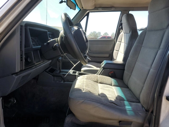 1995 Jeep Cherokee Sport with VIN 1J4FJ68S0SL646747, listed as a Copart auction lot 48772675 with 239,834 mi miles and Salvage title. Bid and sale history available at DreamBid. Image 7.