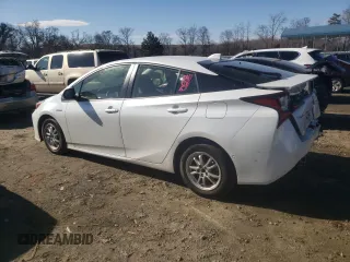 2021 Toyota Prius L Eco z VIN JTDKAMFU3M3150096, wystawiony jako Copart lot #89049225 z przebiegiem 57 823 mil mil oraz Szkoda całkowita • Salvage title. Historia ofert i sprzedaży dostępna na DreamBid. Obrazek 2.