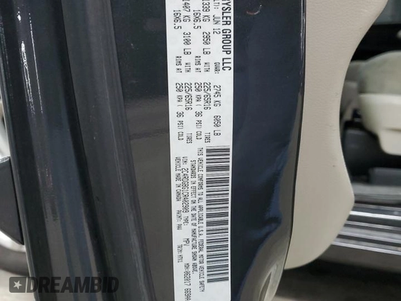 2012 Dodge Grand Caravan SE with VIN 2C4RDGBG1CR402909, listed as a Copart auction lot 51176555 with 223,976 mi miles and Salvage Title. Bid and sale history available at DreamBid. Image 13.