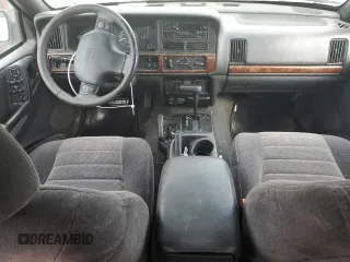 1997 Jeep Grand Cherokee Laredo with VIN 1J4GZ58S2VC676652, listed as a Copart auction lot 64939974 with 256,923 mi miles and Salvage Title. Bid and sale history available at carsss.com. Image 8.