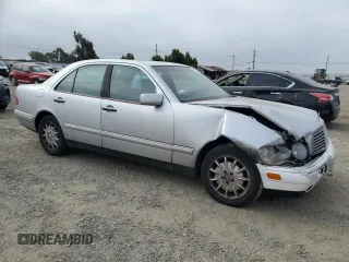 1999 Mercedes-Benz E-Class with VIN WDBJF65H0XA797390, listed as a Copart auction lot 55081405 with 80,950 mi miles and Salvage Title. Bid and sale history available at carsss.com. Image 4.