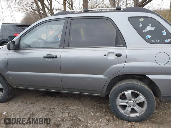2009 Kia Sportage LX with VIN KNDJF724997570871, listed as a IAAI auction lot 41003267 with 231,654 mi miles and . Bid and sale history available at carsss.com. Image 14.
