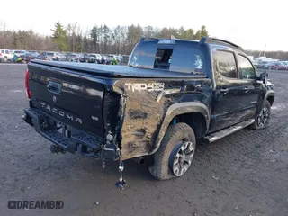2019 Toyota Tacoma 4WD SR with VIN 3TMCZ5AN0KM261364, listed as a IAAI auction lot 41845950 with 85,230 mi miles. Bid and sale history available at carsss.com. Image 4.