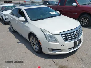 2013 Cadillac XTS Premium z VIN 2G61S5S33D9235025, wystawiony jako IAAI lot #42288742 z przebiegiem 180 221 mil mil oraz . Historia ofert i sprzedaży dostępna na DreamBid. Obrazek 1.