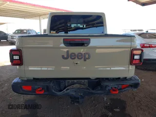 2022 Jeep Gladiator Rubicon with VIN 1C6JJTBG2NL164117, listed as a IAAI auction lot 42450350 with 22,326 mi miles and . Bid and sale history available at DreamBid. Image 16.