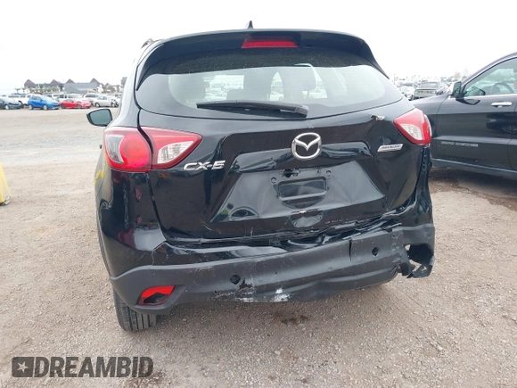 2016 Mazda CX-5 Sport with VIN JM3KE2BY4G0761933, listed as a IAAI auction lot 41709274 with 131,127 mi miles. Bid and sale history available at carsss.com. Image 6.