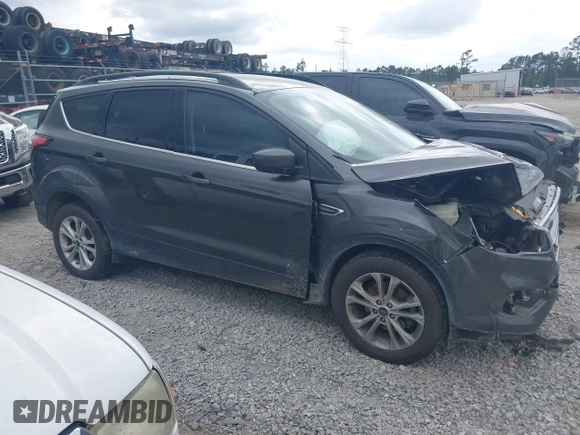 2017 Ford Escape SE z VIN 1FMCU0GD8HUE00754, wystawiony jako IAAI lot #42127911 z przebiegiem 169 487 mil mil oraz . Historia ofert i sprzedaży dostępna na DreamBid. Obrazek 13.