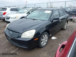 2007 Kia Optima LX with VIN KNAGE124975133923, listed as a IAAI auction lot 42007990 with 87,768 mi miles. Bid and sale history available at carsss.com. Image 2.