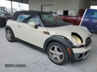 2010 MINI Convertible with VIN WMWMR3C59ATU98597, listed as a Copart auction lot 53336025 with 88,273 mi miles and Salvage Title. Bid and sale history available at DreamBid. Image 4.