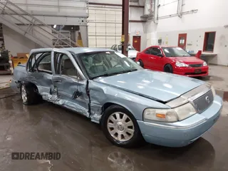 2003 Mercury Grand Marquis LS Premium z VIN 2MEFM75W13X669774, wystawiony jako IAAI lot #42087293 z przebiegiem 170 555 mil mil oraz . Historia ofert i sprzedaży dostępna na DreamBid. Obrazek 1.