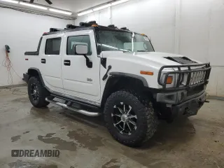 2005 Hummer H2 SUT with VIN 5GRGN22U15H123731, listed as a Copart auction lot 87680395 with 205,043 mi miles and Salvage Title. Bid and sale history available at carsss.com. Image 4.