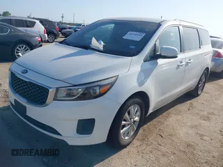2015 Kia Sedona LX with VIN KNDMB5C10F6027850, listed as a IAAI auction lot 42010344 with 127,019 mi miles. Bid and sale history available at carsss.com. Image 2.