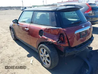 2007 MINI Hardtop with VIN WMWMF33537TU60428, listed as a IAAI auction lot 41753810 with 218,137 mi miles and . Bid and sale history available at DreamBid. Image 3.