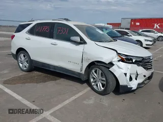2019 Chevrolet Equinox Premier z VIN 2GNAXYEX9K6231775, wystawiony jako IAAI lot #41837331 z przebiegiem 99 736 mil mil oraz . Historia ofert i sprzedaży dostępna na DreamBid. Obrazek 1.