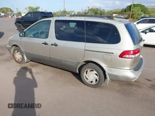 2002 Toyota Sienna LE with VIN 4T3ZF13C82U457803, listed as a IAAI auction lot 41198246 with 185,445 mi miles and . Bid and sale history available at DreamBid. Image 3.