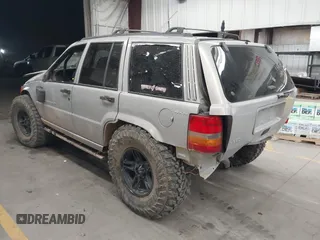 1998 Jeep Grand Cherokee Laredo with VIN 1J4GZ48Y9WC206957, listed as a IAAI auction lot 41848433 with 122,104 mi miles. Bid and sale history available at carsss.com. Image 3.