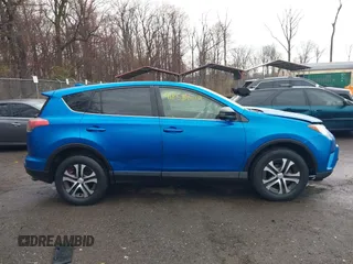2016 Toyota RAV4 LE with VIN JTMBFREV9GJ100635, listed as a IAAI auction lot 41858669 with 171,644 mi miles. Bid and sale history available at carsss.com. Image 13.