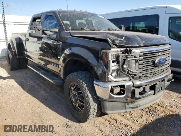 2022 Ford F-350 XL with VIN 1FT8W3DT9NEC09111, listed as a Copart auction lot 52178455 with 128,690 mi miles and Salvage title. Bid and sale history available at DreamBid. Image 4.
