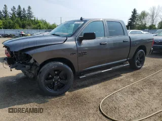 2021 Ram 1500 Tradesman with VIN 3C6RR7KT1MG707114, listed as a Copart auction lot 61022995 with 98,124 mi miles and Salvage title. Bid and sale history available at DreamBid. Image 1.