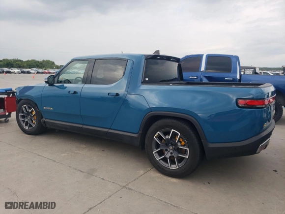 2023 Rivian R1T Adventure with VIN 7FCTGAAA8PN017335, listed as a Copart auction lot 63705604 with 0 mi miles and Clean Title. Bid and sale history available at carsss.com. Image 2.