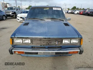 1982 Datsun 720 z VIN JN6SD01SXCW102918, wystawiony jako Copart lot #51125715 z przebiegiem 226 428 mil mil oraz Tytuł czysty. Historia ofert i sprzedaży dostępna na DreamBid. Obrazek 5.