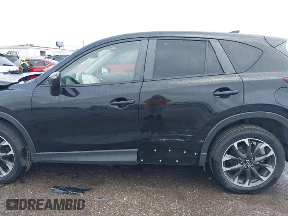 2016 Mazda CX-5 Grand Touring z VIN JM3KE4DY9G0605489, wystawiony jako IAAI lot #42085160 z przebiegiem 160 338 mil mil oraz . Historia ofert i sprzedaży dostępna na DreamBid. Obrazek 14.