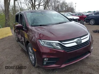 2018 Honda Odyssey EX-L z VIN 5FNRL6H71JB072363, wystawiony jako IAAI lot #41954744 z przebiegiem 104 820 mil mil oraz . Historia ofert i sprzedaży dostępna na DreamBid. Obrazek 1.