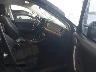 2016 Mazda CX-5 Touring with VIN JM3KE2CY2G0808424, listed as a IAAI auction lot 41880494 with 149,005 mi miles. Bid and sale history available at carsss.com. Image 5.