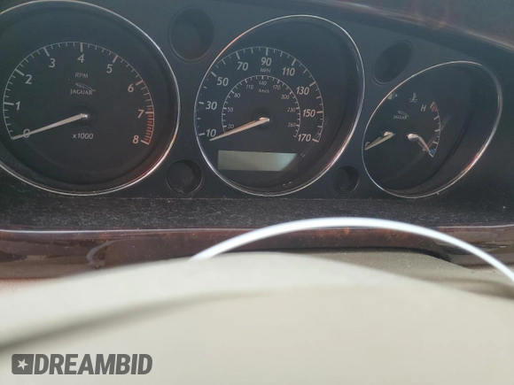 2004 Jaguar XJ with VIN SAJWA71C44SG34094, listed as a Copart auction lot 74969004 with 0 mi miles and Salvage Title. Bid and sale history available at carsss.com. Image 9.