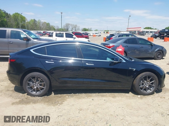 2018 Tesla Model 3 Long Range Battery with VIN 5YJ3E1EB1JF122786, listed as a IAAI auction lot 42010451 with 85,510 mi miles and . Bid and sale history available at DreamBid. Image 13.