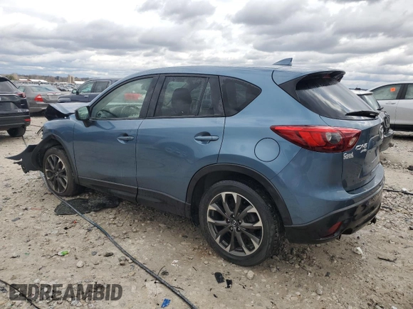 2016 Mazda CX-5 Grand Touring z VIN JM3KE4DY2G0637779, wystawiony jako Copart lot #52001805 z przebiegiem 184 381 mil mil oraz Czysty tytuł • Clean title. Historia ofert i sprzedaży dostępna na DreamBid. Obrazek 2.