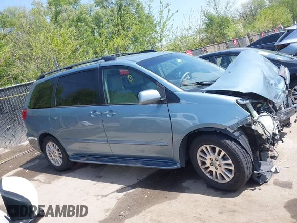 2009 Toyota Sienna XLE with VIN 5TDZK22C99S239755, listed as a IAAI auction lot 42096411 with 214,983 mi miles. Bid and sale history available at carsss.com. Image 14.