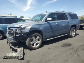 2015 Chevrolet Suburban LT with VIN 1GNSKJKC8FR691113, listed as a Copart auction lot 57121675 with 136,343 mi miles and Salvage title. Bid and sale history available at DreamBid. Image 1.