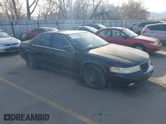 2002 Cadillac Seville Touring STS z VIN 1G6KY54972U193737, wystawiony jako IAAI lot #41876511 z przebiegiem 165 571 mil mil oraz . Historia ofert i sprzedaży dostępna na DreamBid. Obrazek 1.