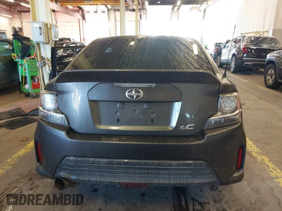 2014 Scion tC with VIN JTKJF5C77E3069906, listed as a IAAI auction lot 41243445 with 128,791 mi miles. Bid and sale history available at carsss.com. Image 16.