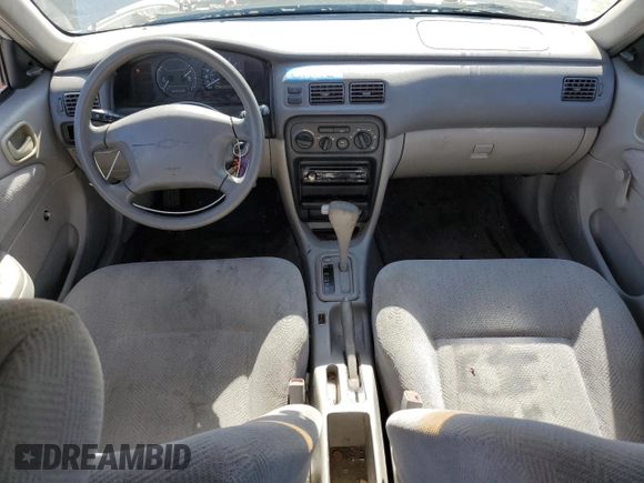 2002 Chevrolet Prizm z VIN 1Y1SK52862Z410699, wystawiony jako Copart lot #58118425 z przebiegiem 157 609 mil mil oraz Szkoda całkowita • Salvage title. Historia ofert i sprzedaży dostępna na DreamBid. Obrazek 8.