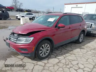 2018 Volkswagen Tiguan S with VIN 3VV1B7AX9JM085312, listed as a IAAI auction lot 41656827 with 122,322 mi miles and . Bid and sale history available at DreamBid. Image 2.