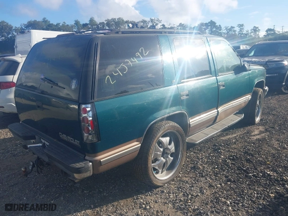 1998 Chevrolet Tahoe with VIN 1GNEK13R1WJ302987, listed as a IAAI auction lot 40491593 with 999,999 mi miles. Bid and sale history available at carsss.com. Image 4.