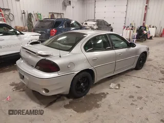 2004 Pontiac Grand Am GT with VIN 1G2NW52E04M617802, listed as a IAAI auction lot 41353209 with 103,716 mi miles. Bid and sale history available at carsss.com. Image 4.